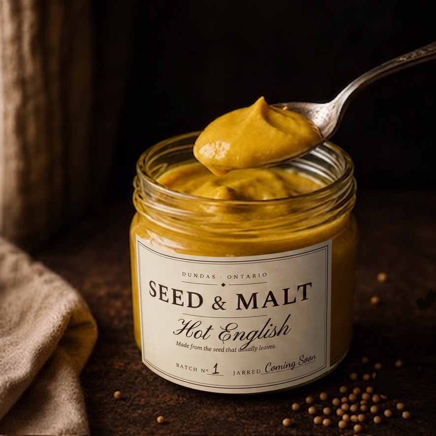 Hot English — bright yellow smooth mustard, a spoon lifting from the jar