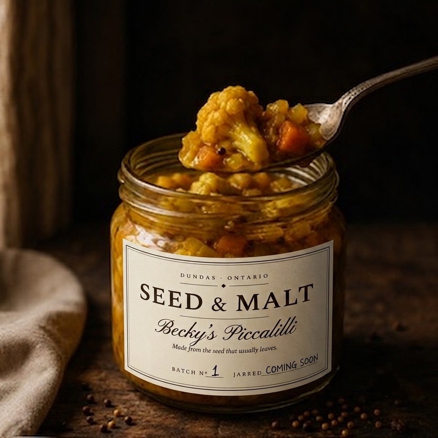 Grandma Becky's piccalilli — golden cauliflower, carrot and mustard seed, a spoon lifting from the jar